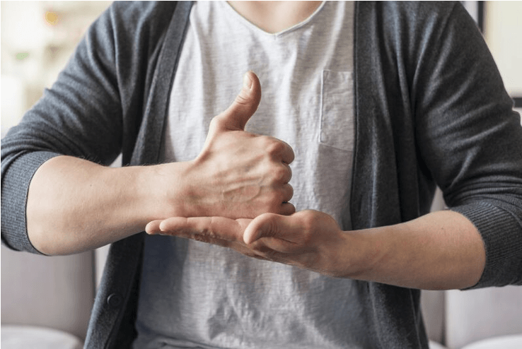 a person make a thumbs up with one hand and put it in the flat palm of the other hand